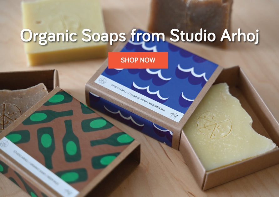 Studio Arhoj Beer Mud and Western Sea soaps arranged on pine plywood background