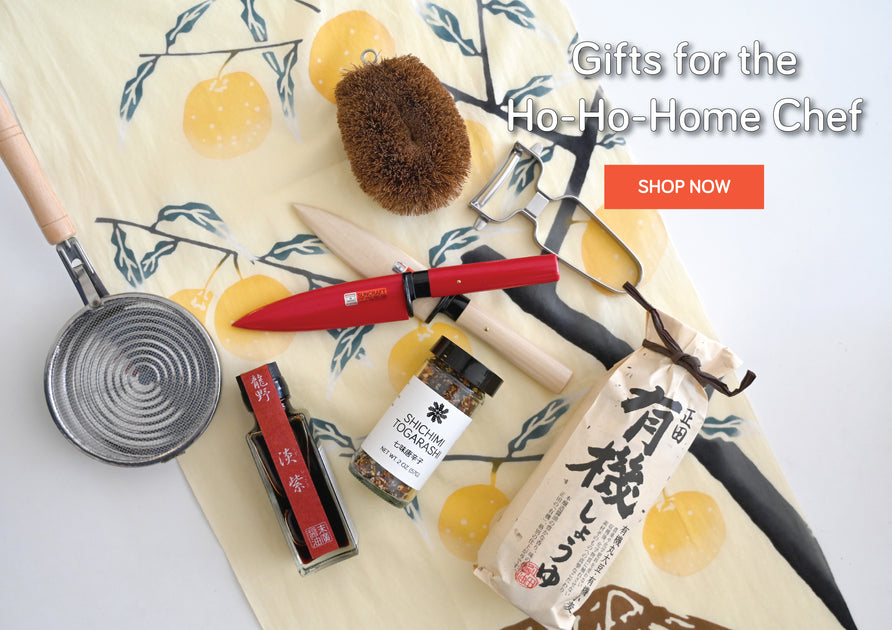 Kitchen items including tawashi, Suncraft Paring knife, peeler, various Japanese condiments on a yuzu tenugui cloth. Gifts for the Ho-Ho-Home Chef!